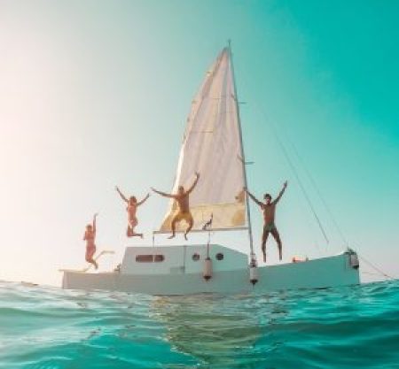 happy-crazy-friends-diving-from-sailing-boat