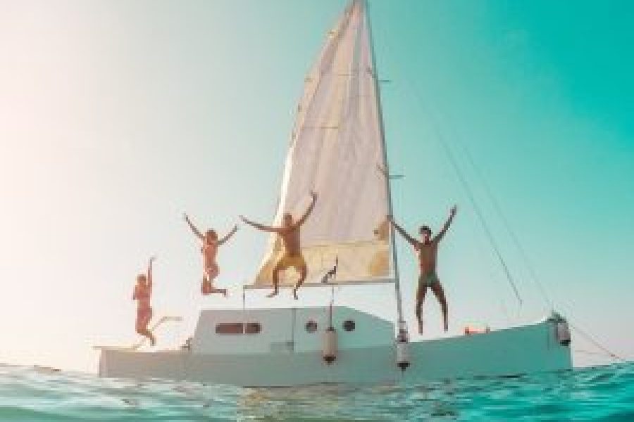 happy-crazy-friends-diving-from-sailing-boat