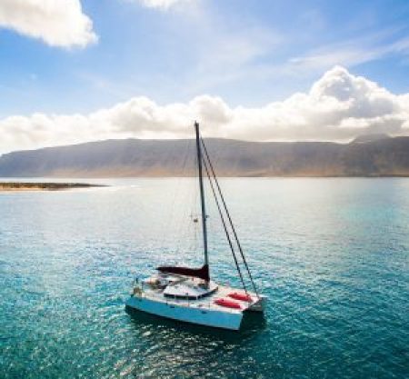 small-boat-sailing-in-beautiful-blue-ocean